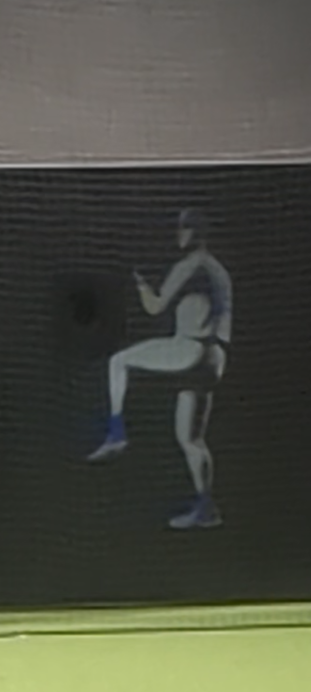 Pitcher mid-windup on simulator screen